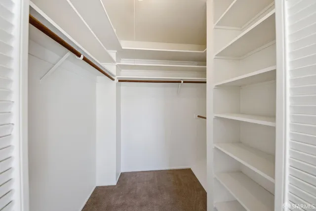 a view of an empty walk in closet