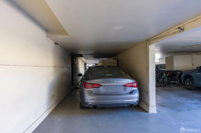 a view of a swimming pool with a lounge chairs in a patio
