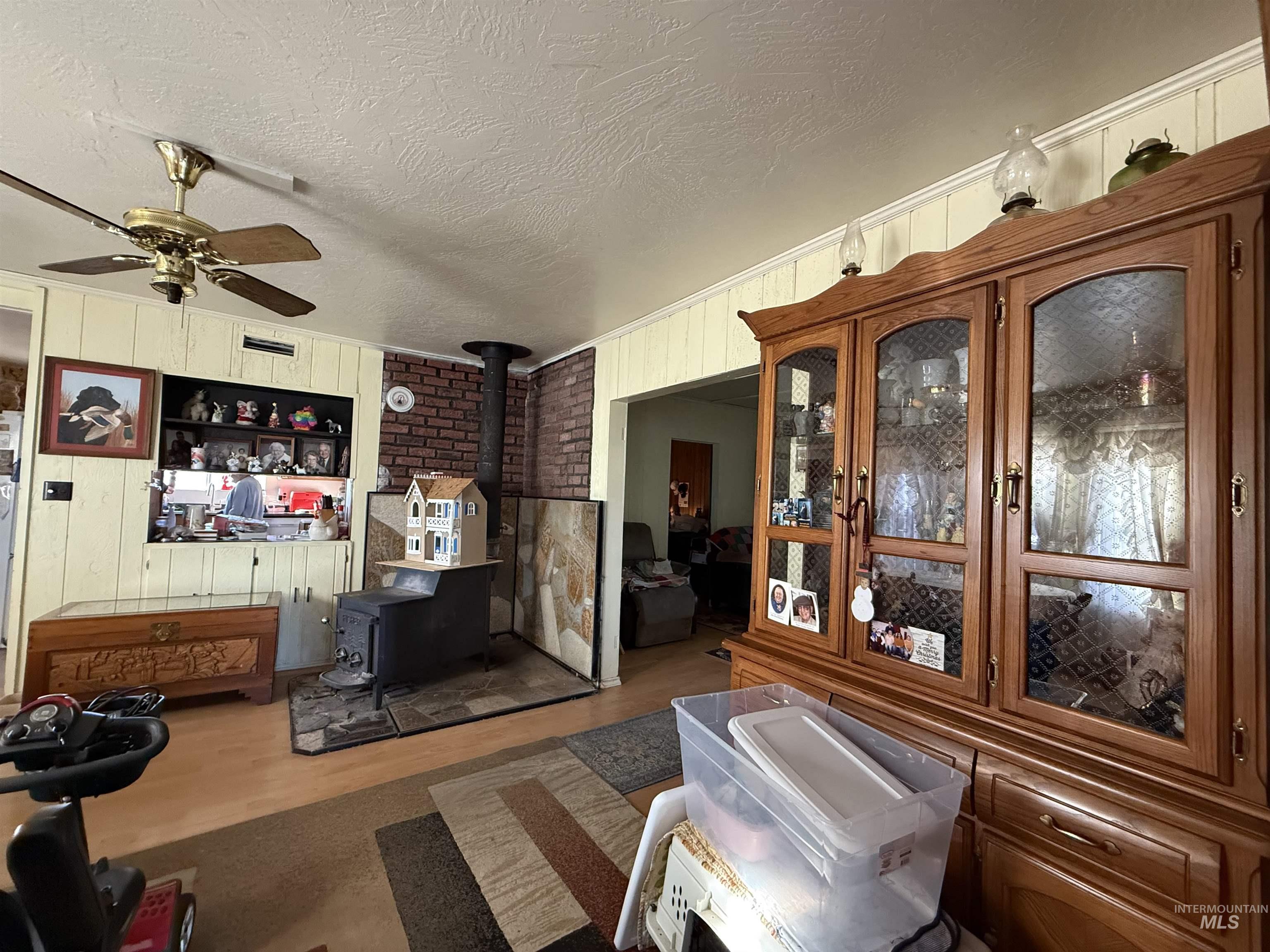 19241 West Homedale Road Caldwell, ID 83607 - Photo 34 of 35 Sunroom with french doors and a wood stove