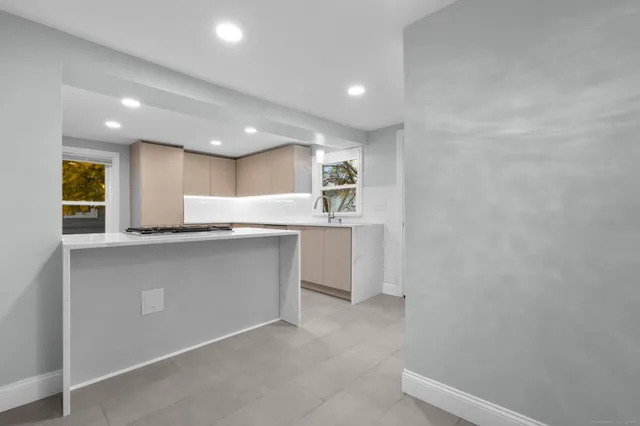 a bathroom with a sink and mirror