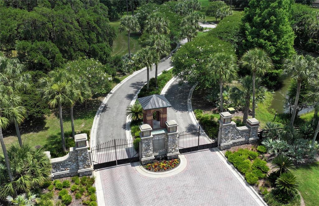 6703 Southwest 40 Terrace Gainesville, FL 32608 - Photo 5 of 5 an aerial view of a house with swimming pool and garden