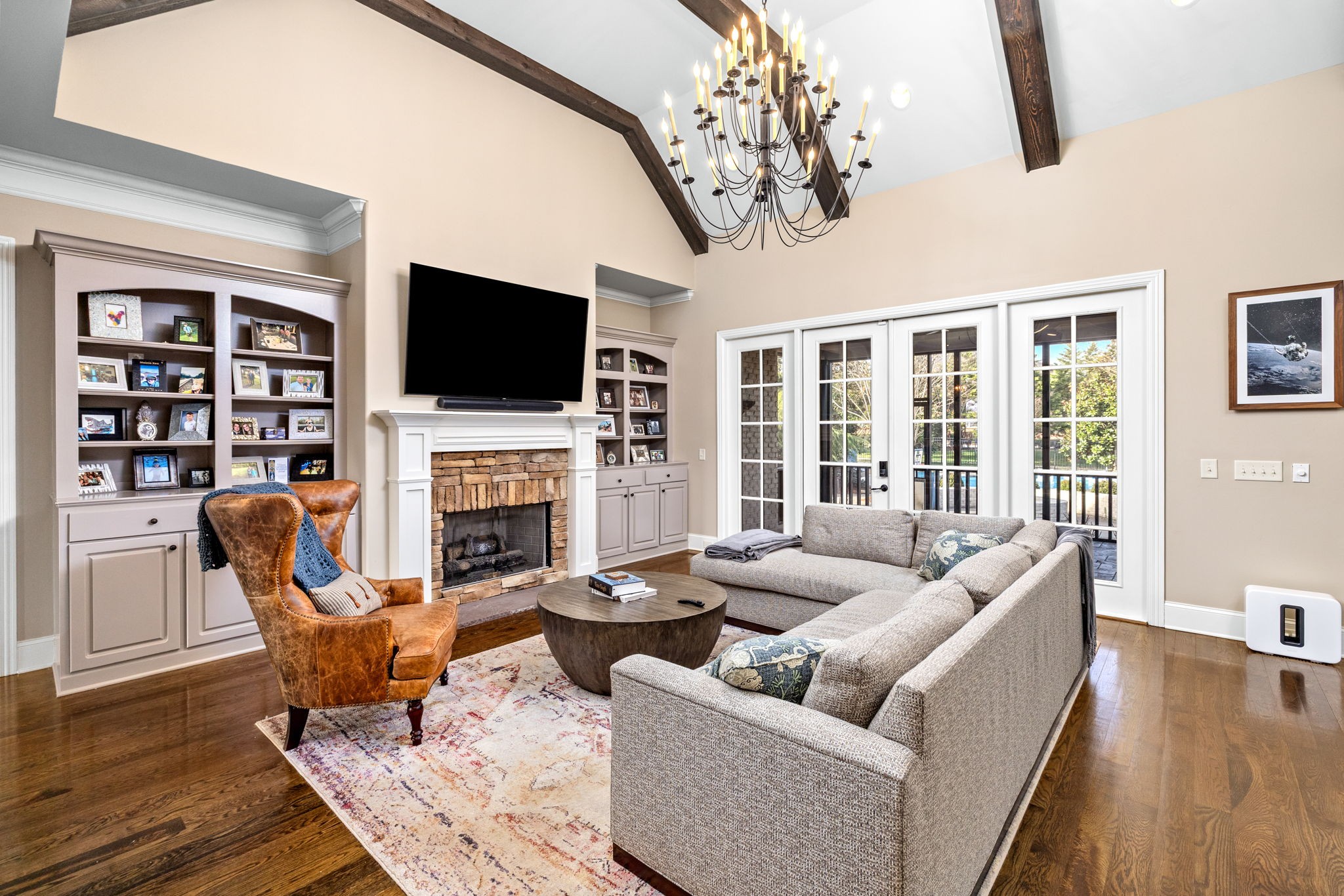 400 Ernest Rice Lane Franklin, TN 37069 - Photo 21 of 62 a living room with furniture a flat screen tv and a fireplace