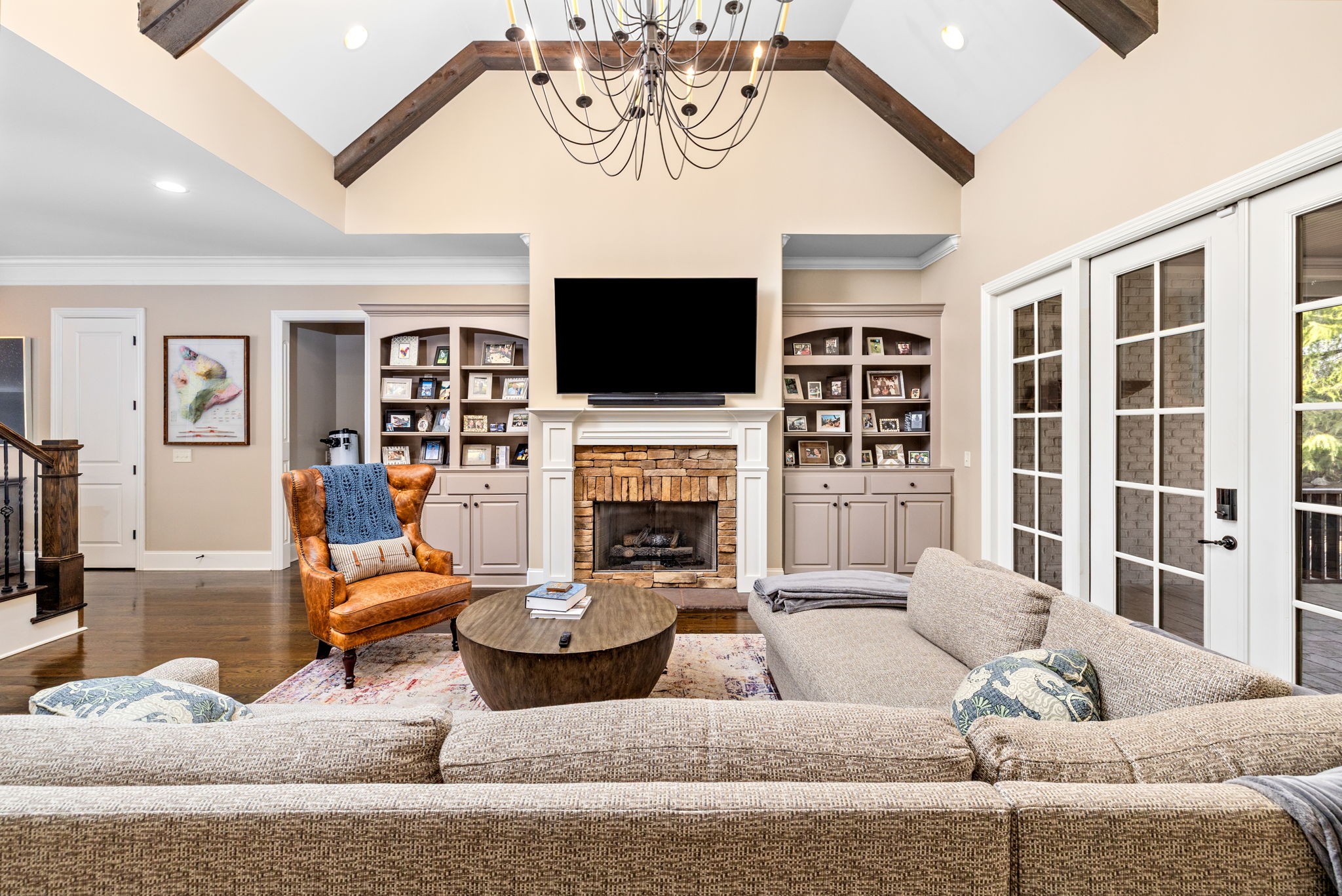 400 Ernest Rice Lane Franklin, TN 37069 - Photo 22 of 62 a living room with furniture a flat screen tv and a fireplace