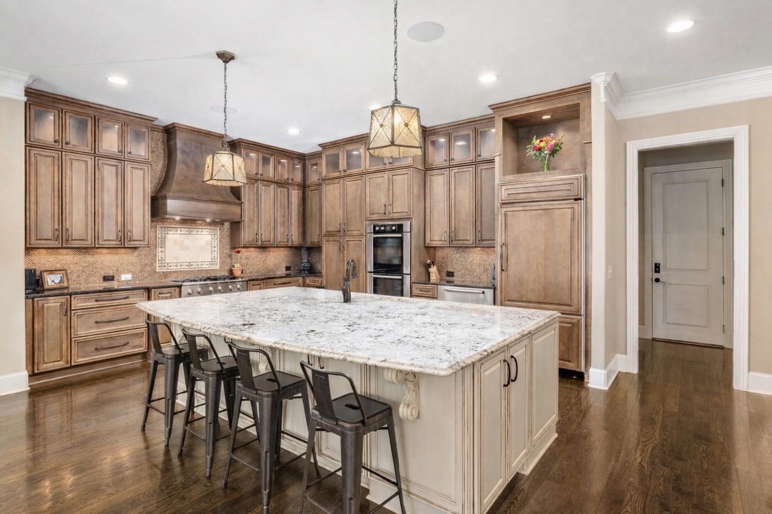 400 Ernest Rice Lane Franklin, TN 37069 - Photo 31 of 62 a kitchen with stainless steel appliances granite countertop a kitchen island a stove a table and chairs