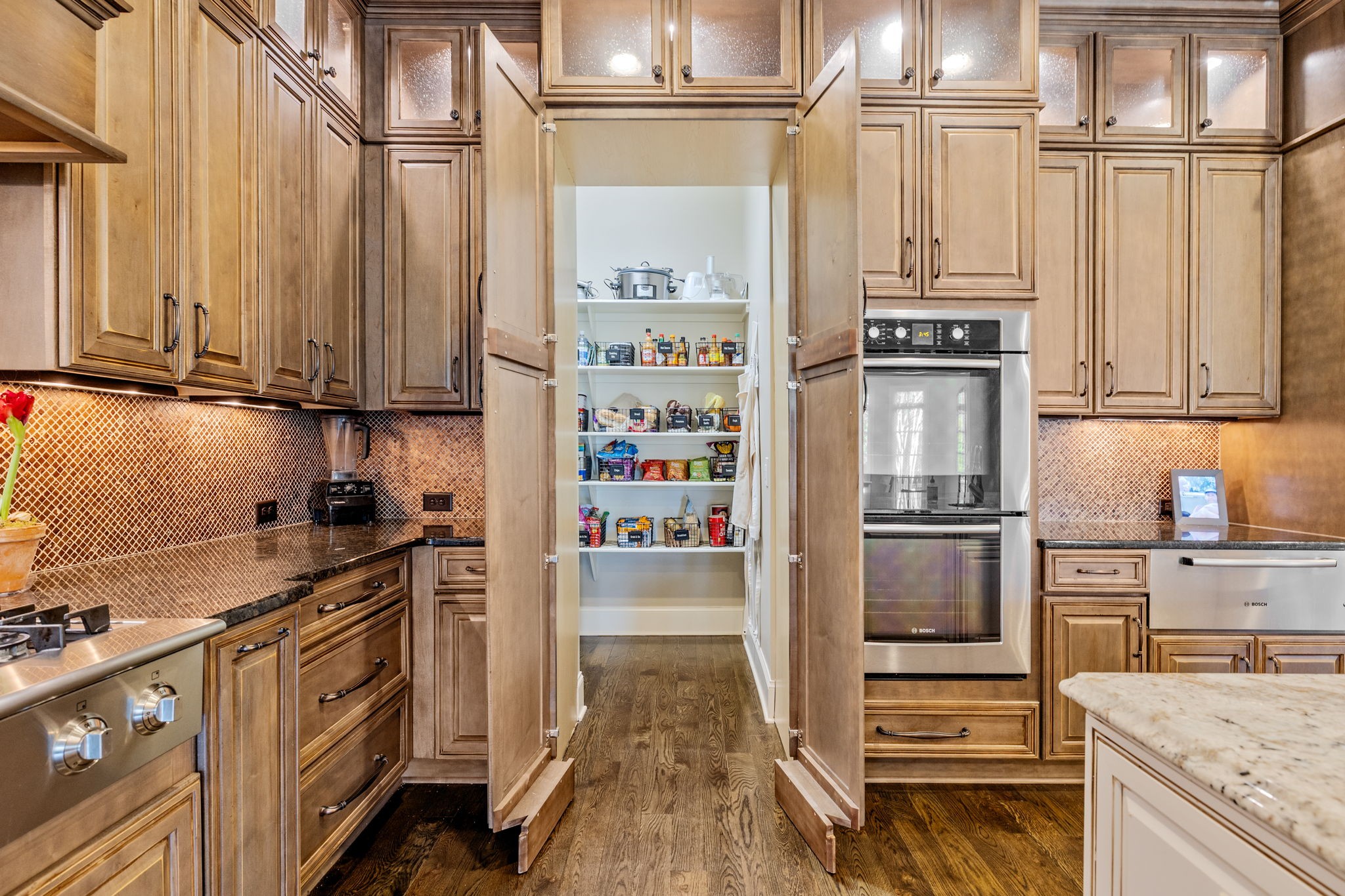 400 Ernest Rice Lane Franklin, TN 37069 - Photo 36 of 62 a kitchen with stainless steel appliances granite countertop a refrigerator and a stove top oven