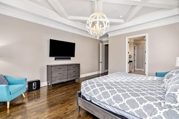 a living room with a fireplace and a flat screen tv
