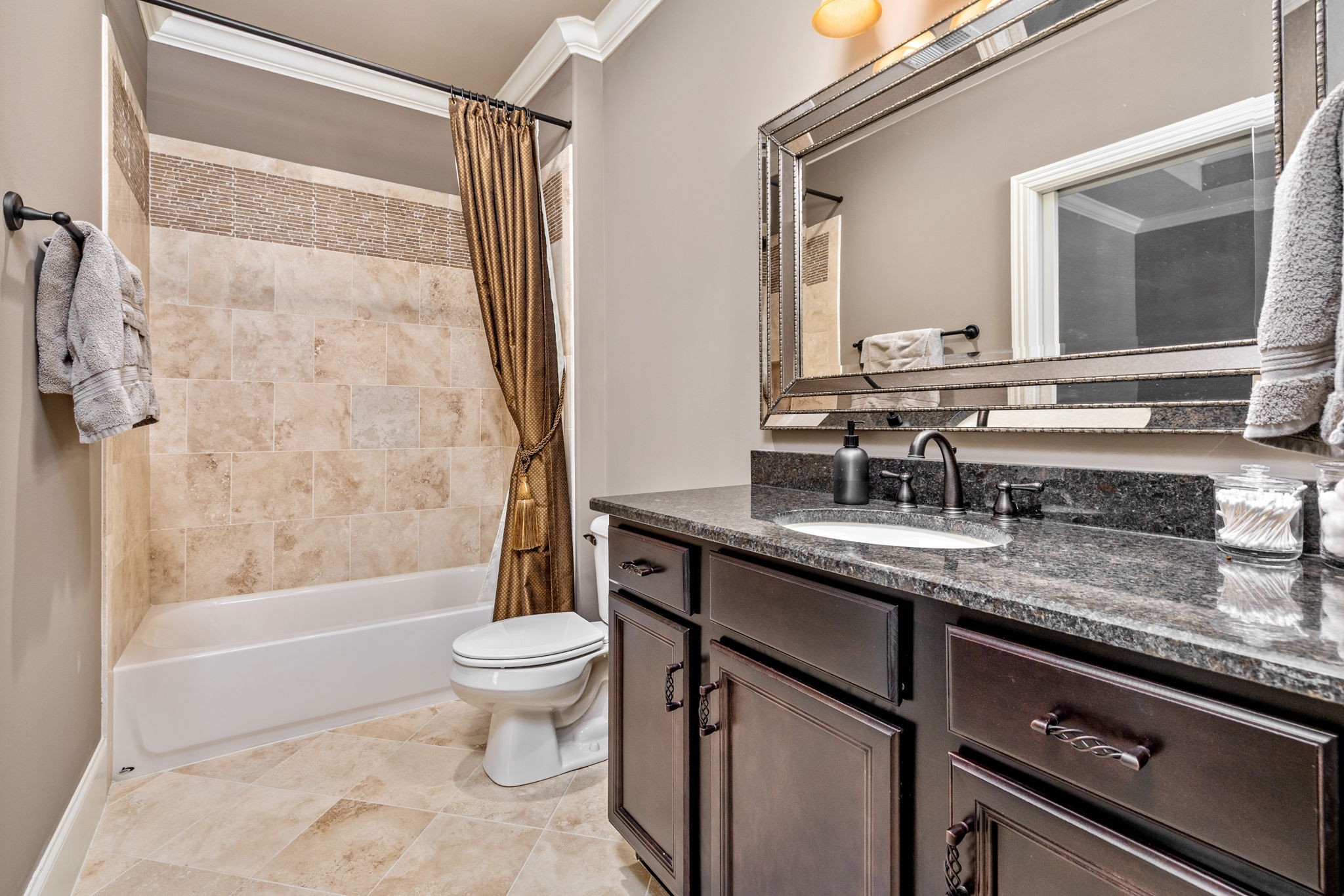 400 Ernest Rice Lane Franklin, TN 37069 - Photo 49 of 62 a bathroom with a granite countertop sink a toilet a mirror and shower