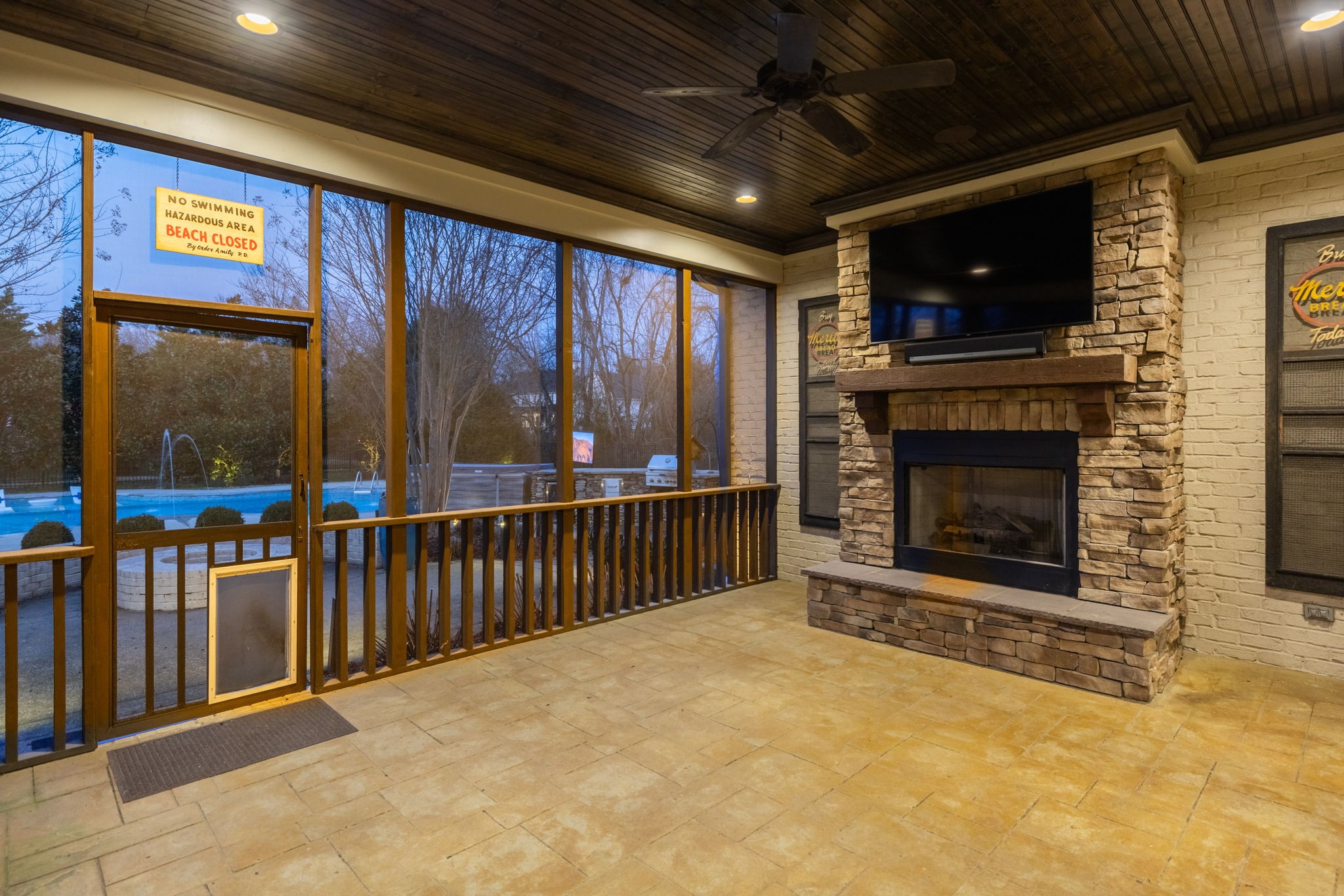 400 Ernest Rice Lane Franklin, TN 37069 - Photo 52 of 62 a living room with a fireplace and a flat screen tv