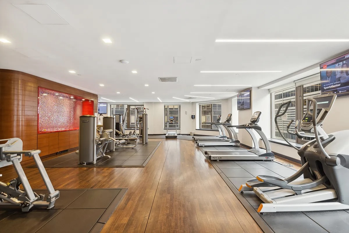 75 Wall Street, Unit PHD2 Manhattan, NY 10005 - Photo 12 of 15 a view of a room with gym equipment