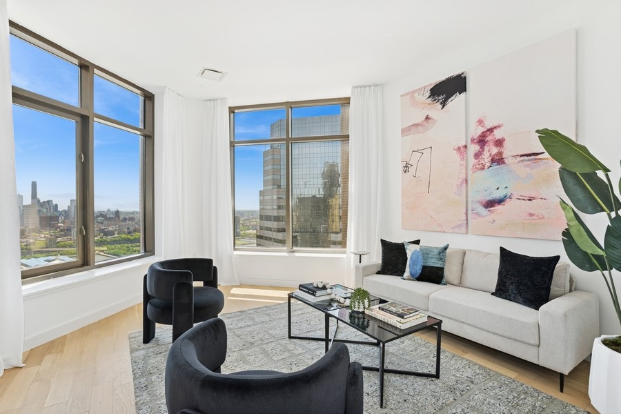 75 Wall Street, Unit PHD2 Manhattan, NY 10005 - Photo 3 of 15 a living room with furniture and a floor to ceiling window