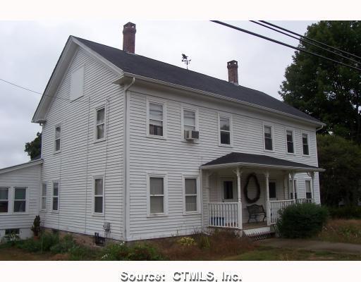 365 Putnam Road Plainfield, CT 06387 - Photo 1 of 1 a front view of a house with a yard