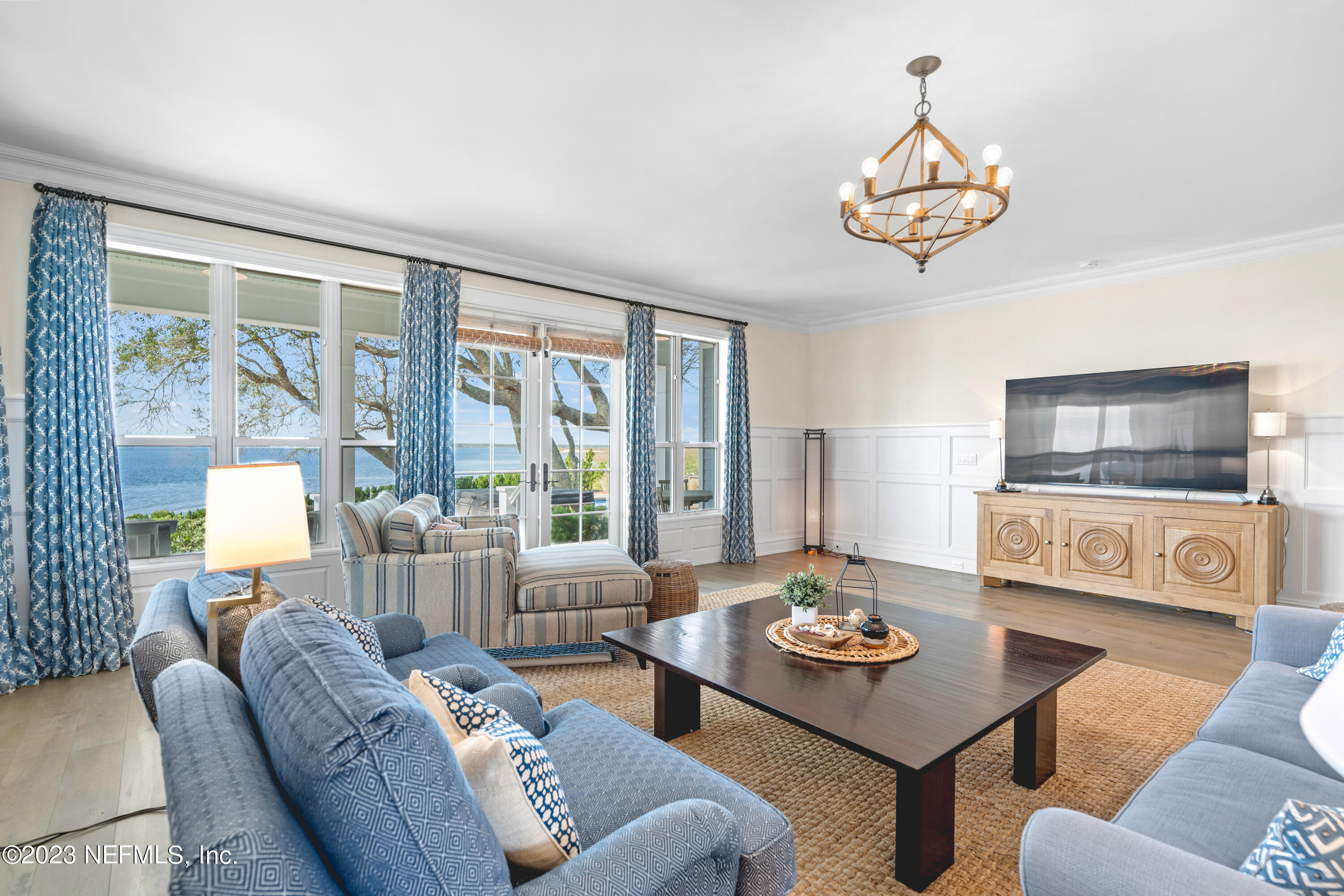 500 North Point Road St. Augustine, FL 32084 - Photo 12 of 102 a living room with furniture and a flat screen tv