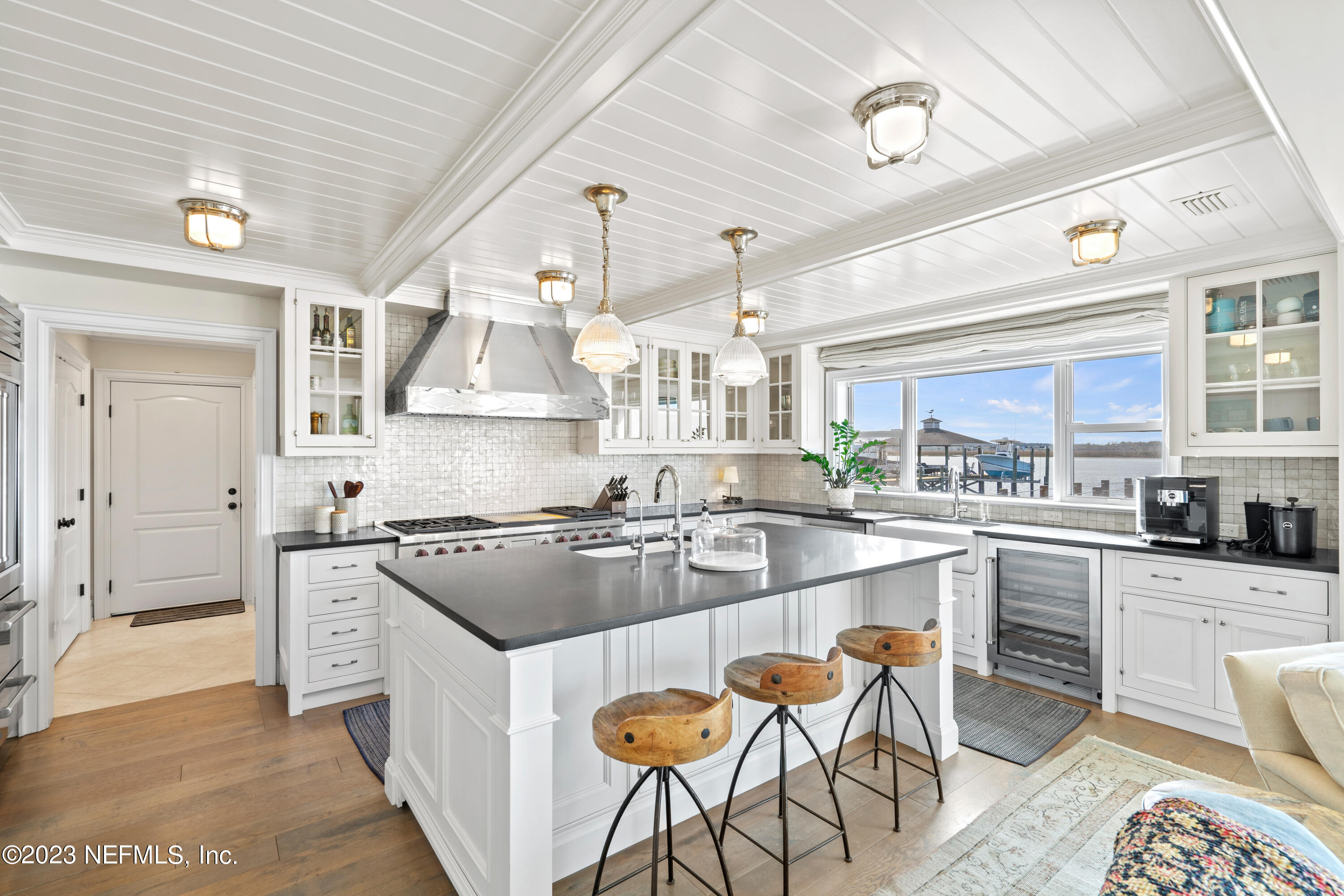 500 North Point Road St. Augustine, FL 32084 - Photo 18 of 102 a kitchen with stainless steel appliances granite countertop a stove and cabinets