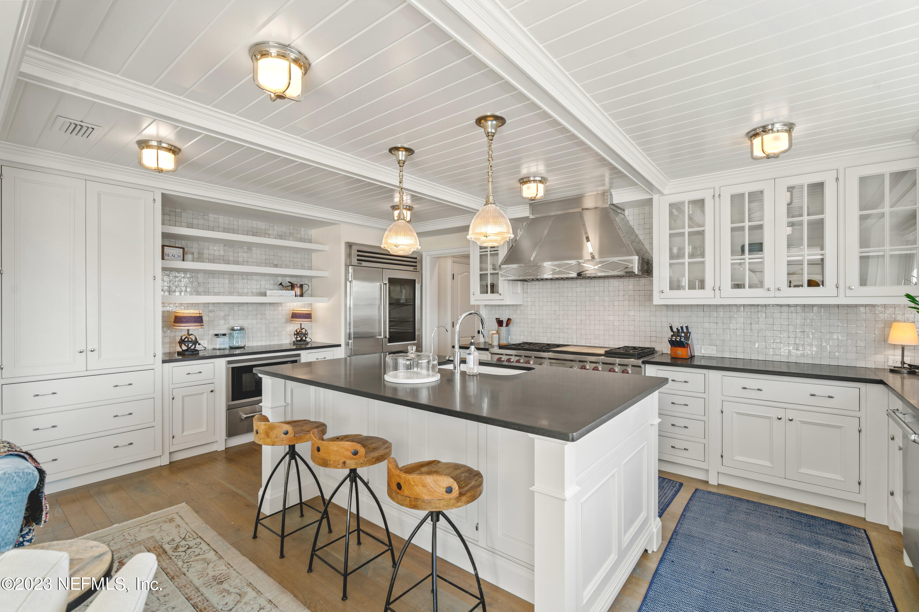 500 North Point Road St. Augustine, FL 32084 - Photo 20 of 102 a kitchen with stainless steel appliances granite countertop a stove and cabinets