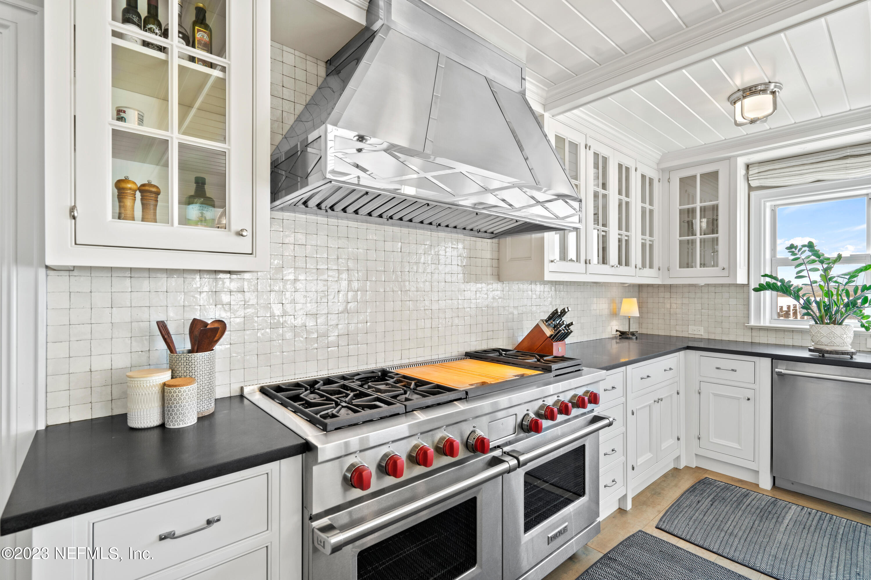 500 North Point Road St. Augustine, FL 32084 - Photo 23 of 102 a kitchen with stainless steel appliances a white stove top oven and sink
