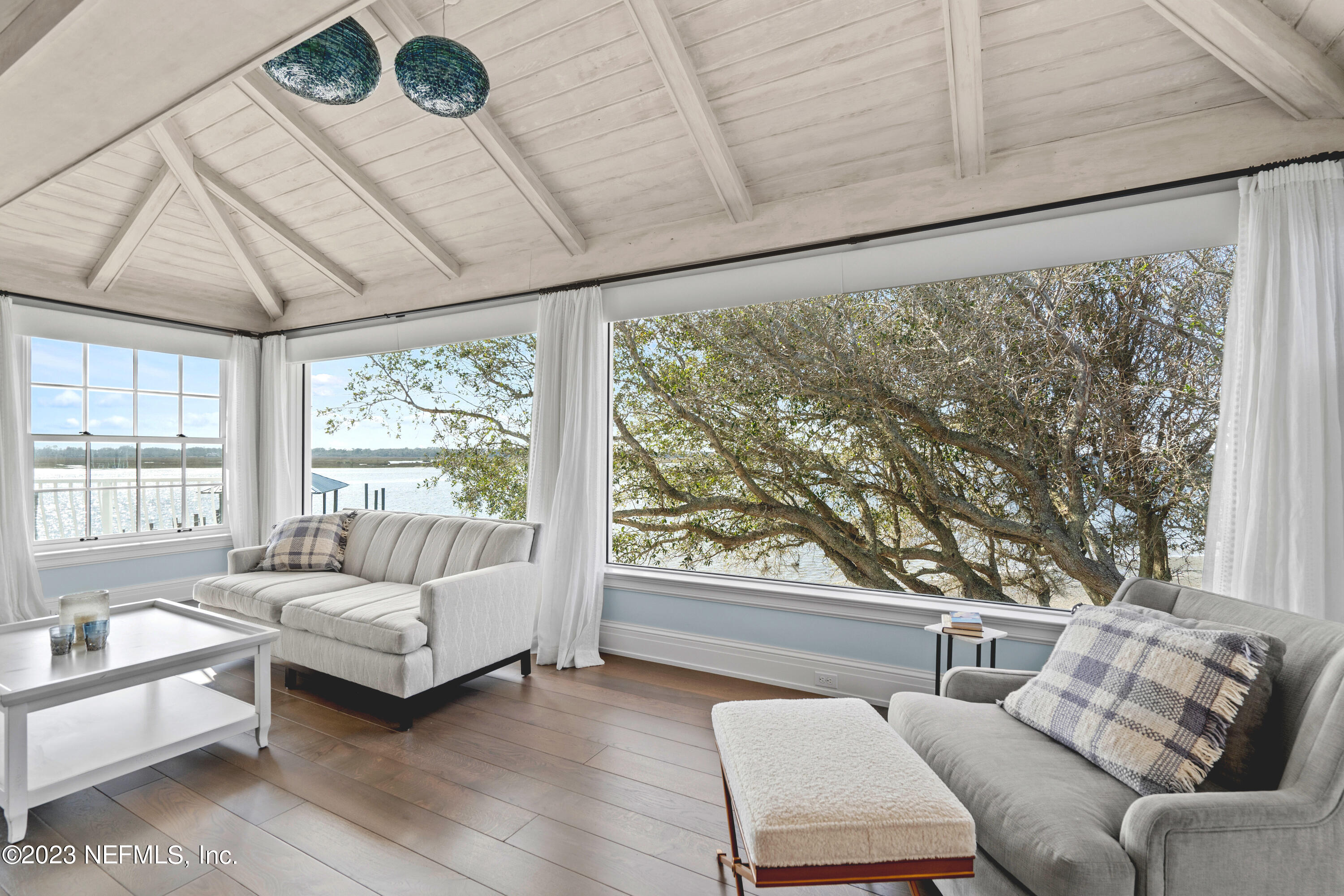 500 North Point Road St. Augustine, FL 32084 - Photo 43 of 102 a living room with furniture and a large window