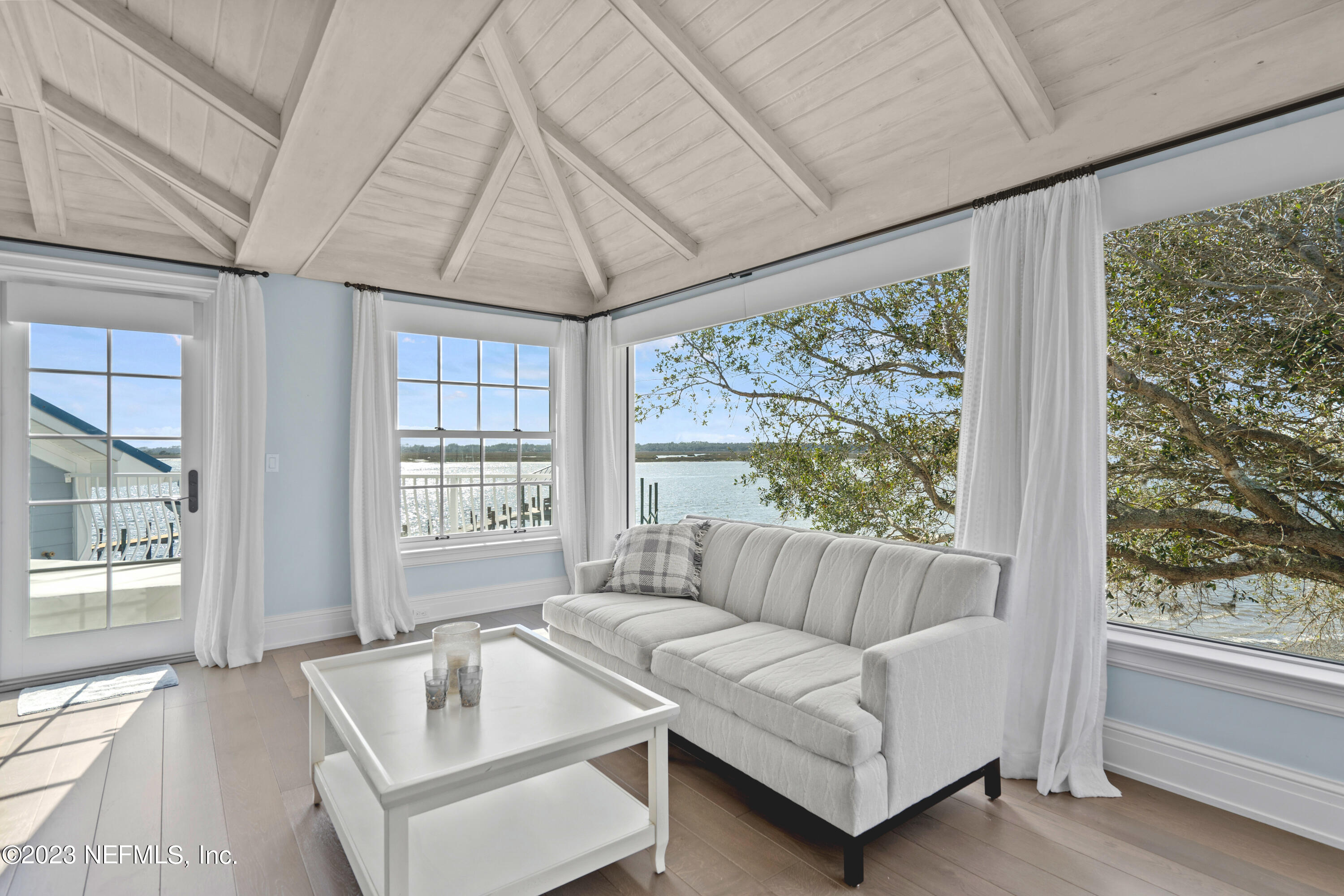 500 North Point Road St. Augustine, FL 32084 - Photo 44 of 102 a living room with furniture and a large window