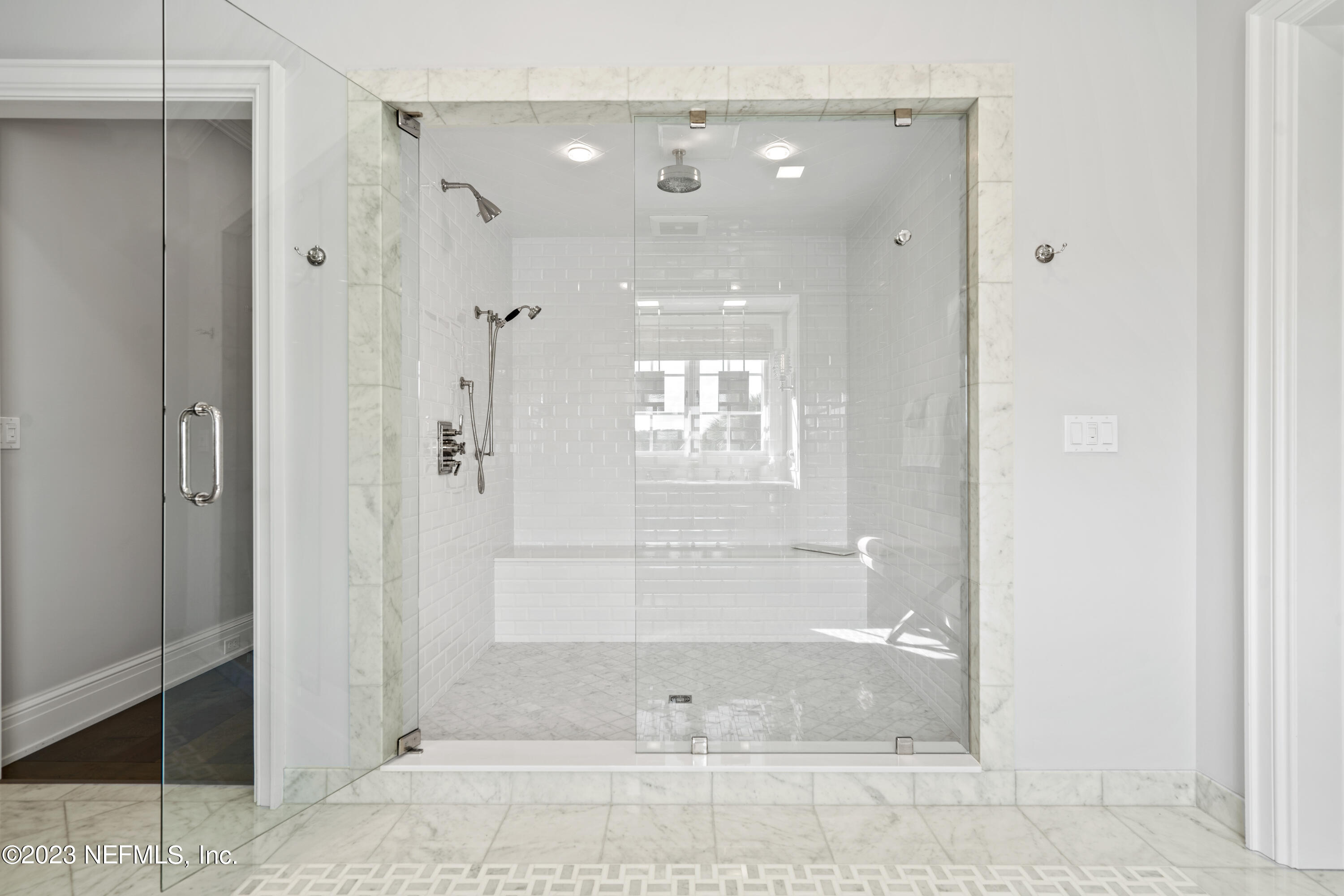 500 North Point Road St. Augustine, FL 32084 - Photo 49 of 102 a bathroom with a glass shower door