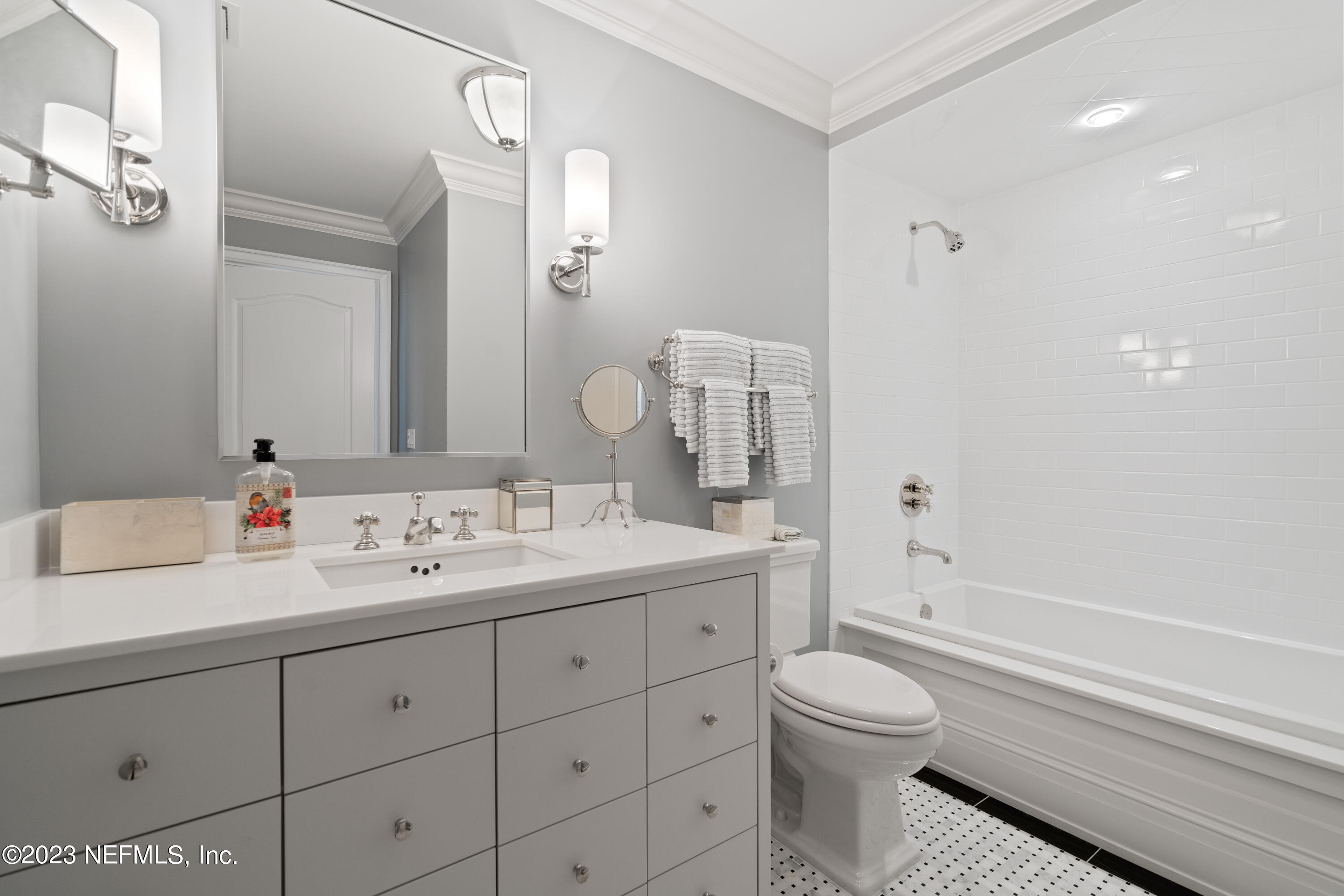 500 North Point Road St. Augustine, FL 32084 - Photo 56 of 102 a bathroom with a toilet sink and mirror