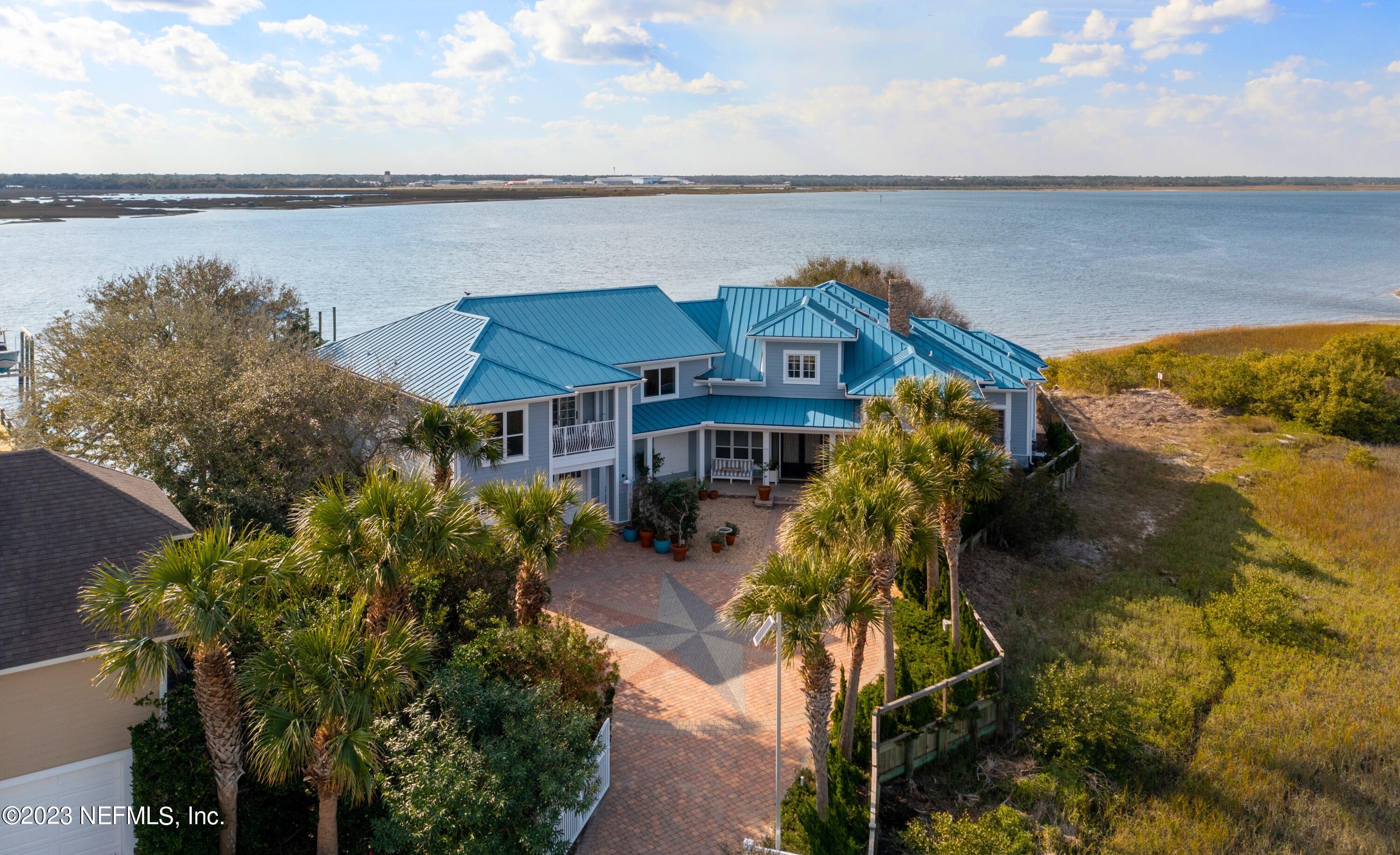 500 North Point Road St. Augustine, FL 32084 - Photo 81 of 102 a aerial view of a house with a garden and lake view