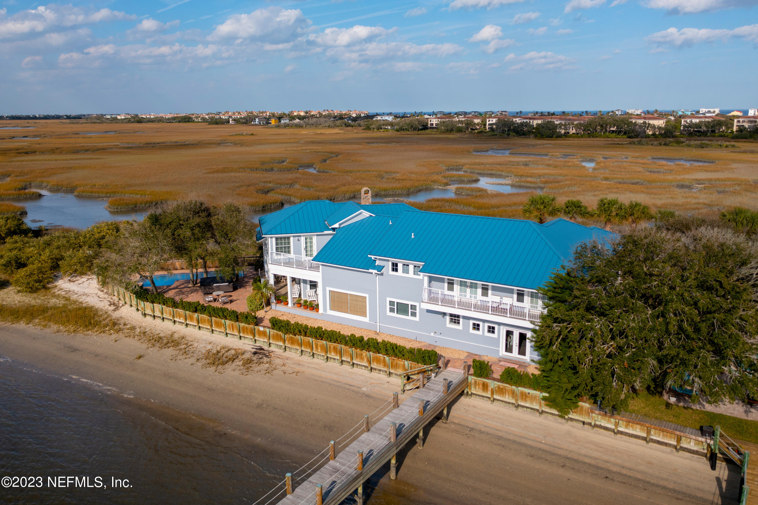 500 North Point Road St. Augustine, FL 32084 - Photo 91 of 102 a view of a lake with a building in the background