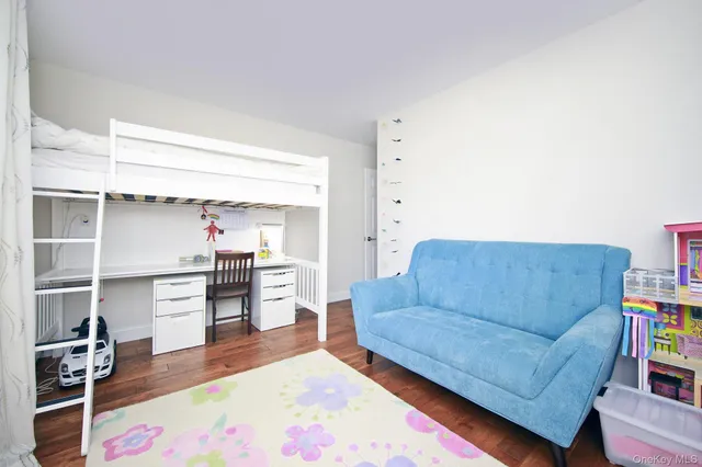 a living room with furniture and a kitchen view