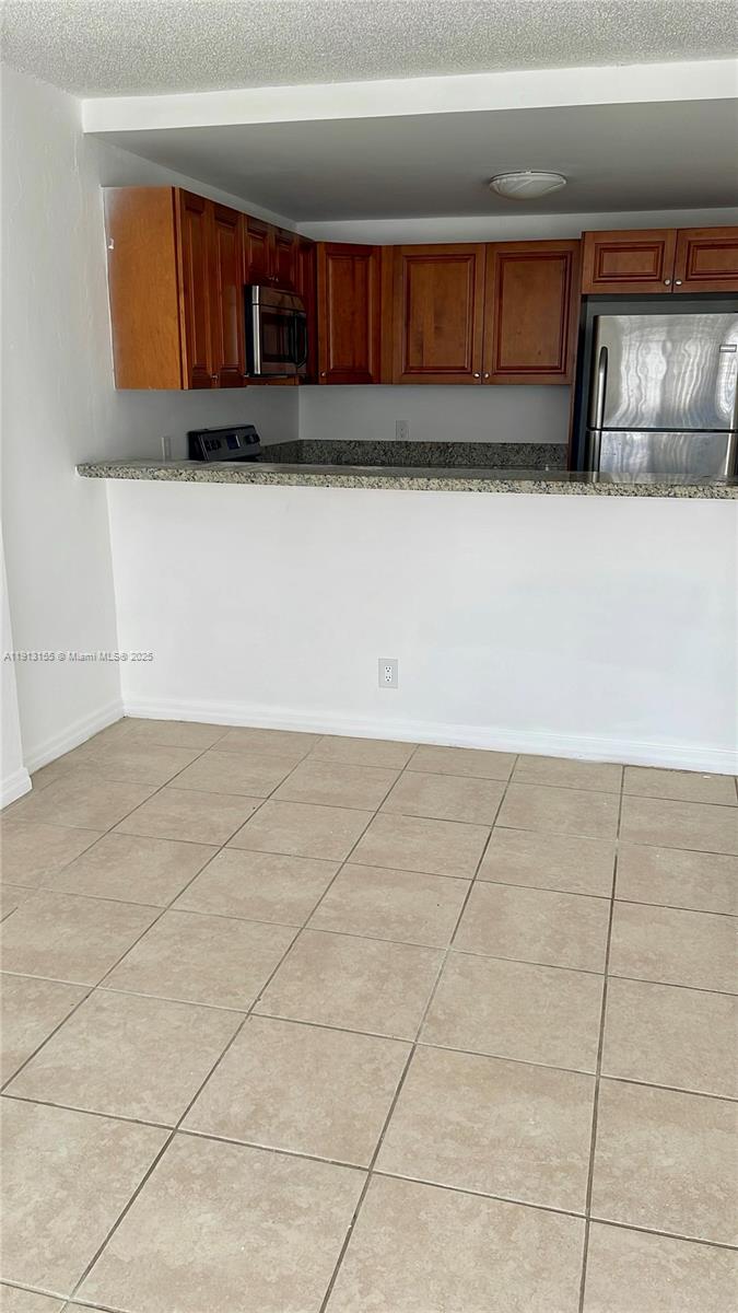 9143 Southwest 77th Avenue, Unit B505 Miami, FL 33156 - Photo 2 of 6 a view of kitchen with cabinets
