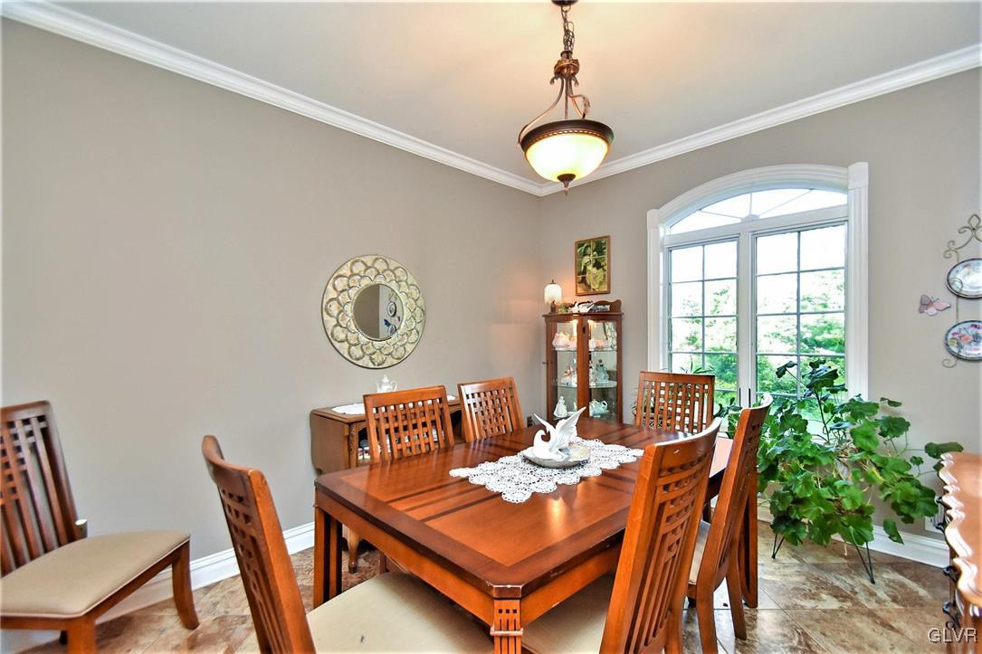 215 Klein Road Bath, PA 18014 - Photo 13 of 44 a dining room with furniture a potted plant and a chandelier