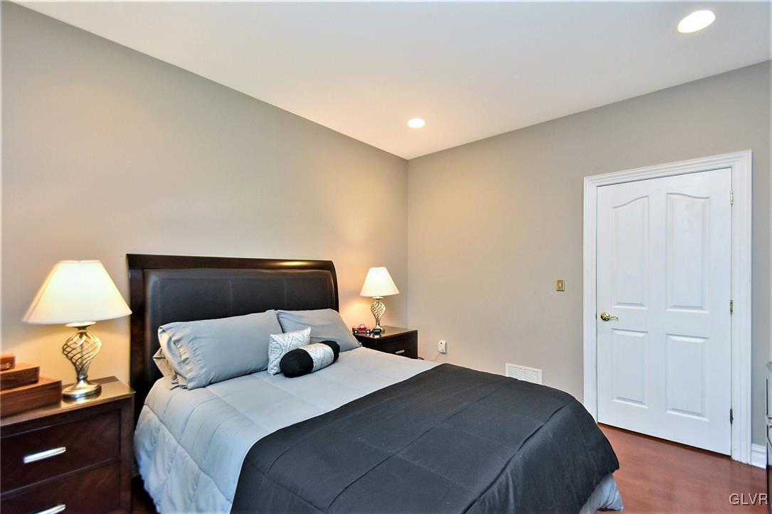 215 Klein Road Bath, PA 18014 - Photo 19 of 44 a bedroom with a bed and a lamp