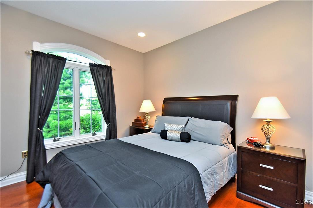 215 Klein Road Bath, PA 18014 - Photo 20 of 44 a bedroom with a bed and a lamp