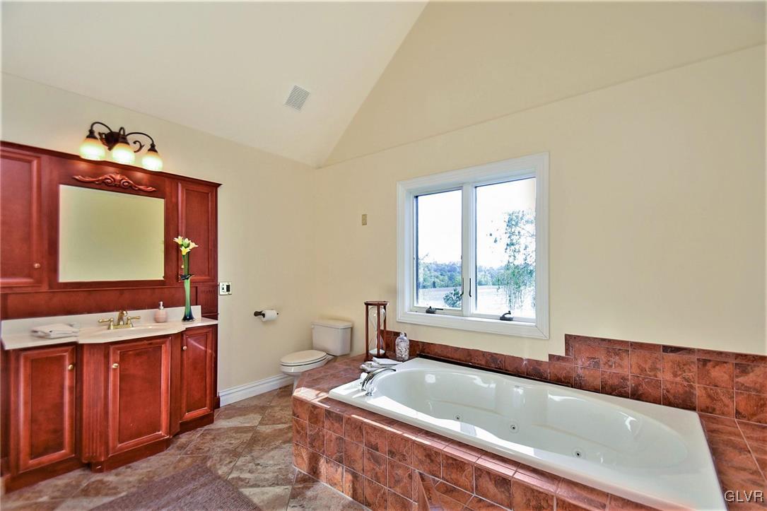 215 Klein Road Bath, PA 18014 - Photo 28 of 44 a bath tub sitting in a bathroom next to a window