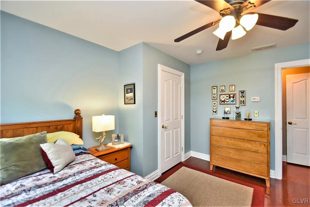 215 Klein Road Bath, PA 18014 - Photo 30 of 44 a bedroom with a bed and wooden floor