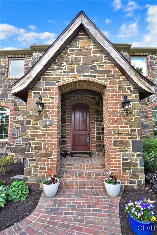 215 Klein Road Bath, PA 18014 - Photo 3 of 44 a front view of a house with lots of flowers