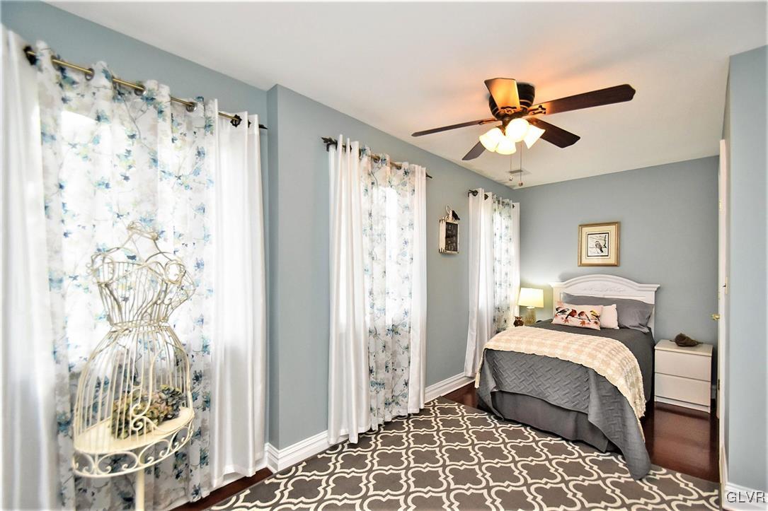 215 Klein Road Bath, PA 18014 - Photo 33 of 44 a bedroom with a bed and a chandelier