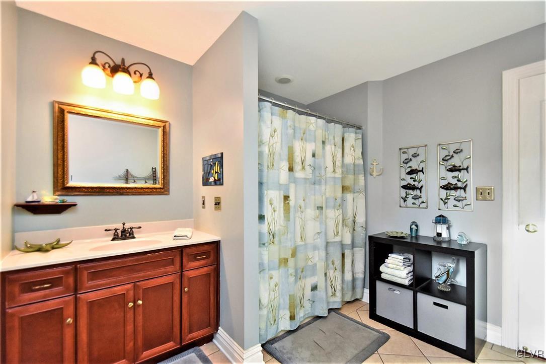 215 Klein Road Bath, PA 18014 - Photo 36 of 44 a en suite bathroom with a double vanity sink mirror and shower