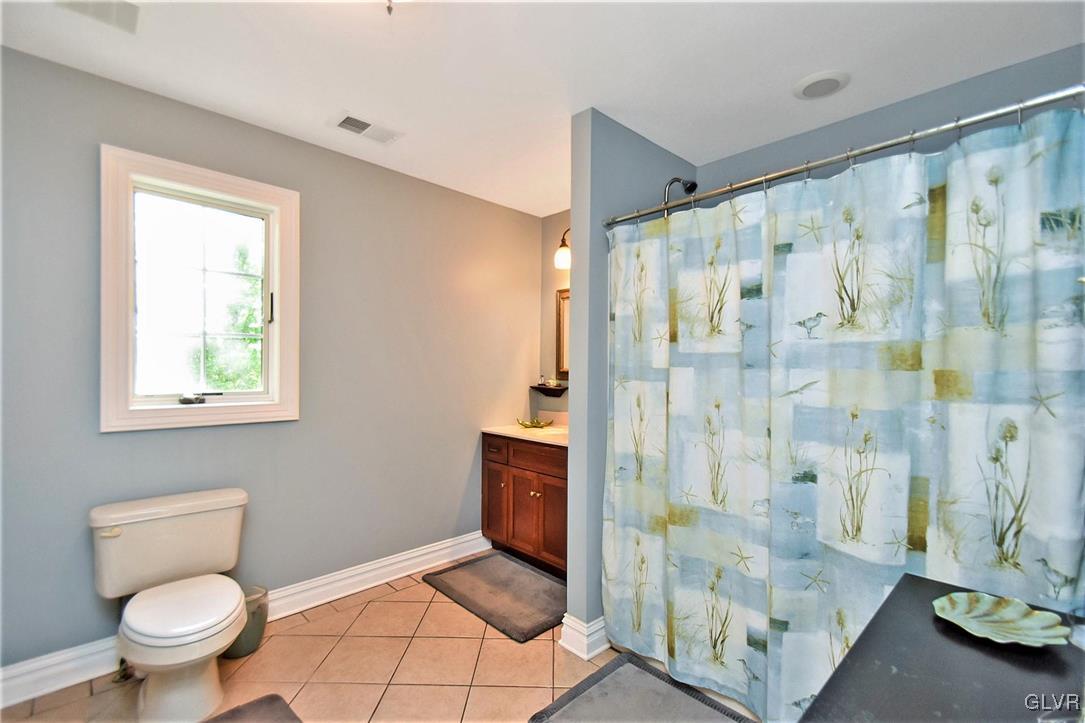 215 Klein Road Bath, PA 18014 - Photo 37 of 44 a bathroom with a shower toilet and sink