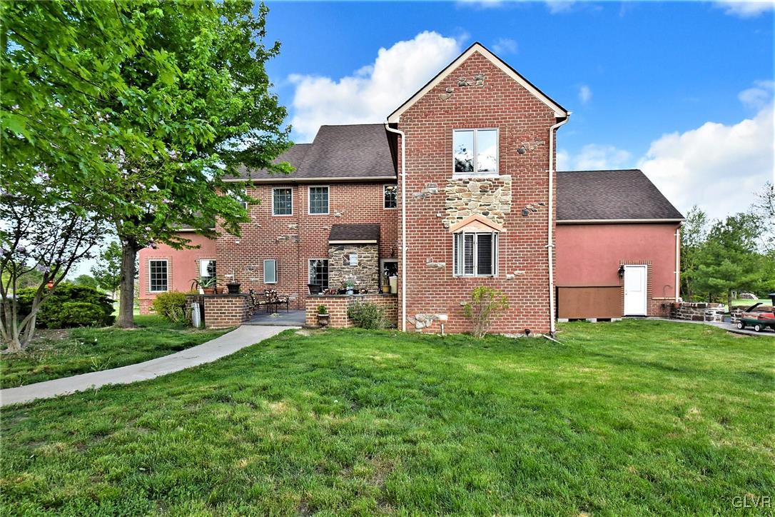 215 Klein Road Bath, PA 18014 - Photo 39 of 44 a front view of a house with a yard and trees