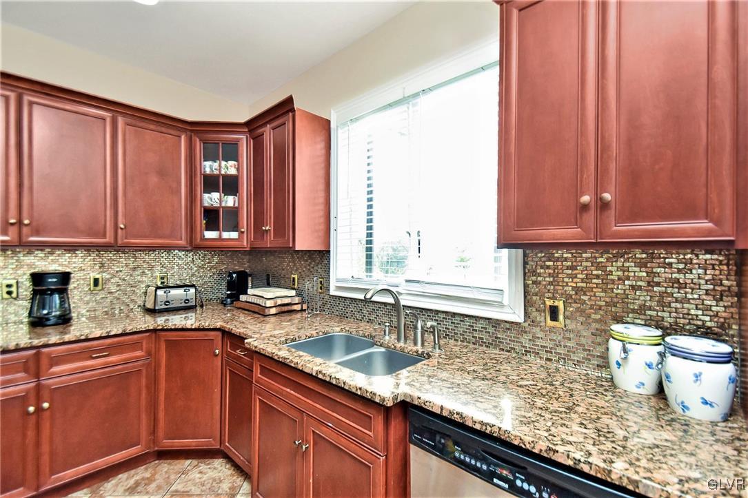 215 Klein Road Bath, PA 18014 - Photo 8 of 44 a kitchen with stainless steel appliances granite countertop a sink stove and cabinets