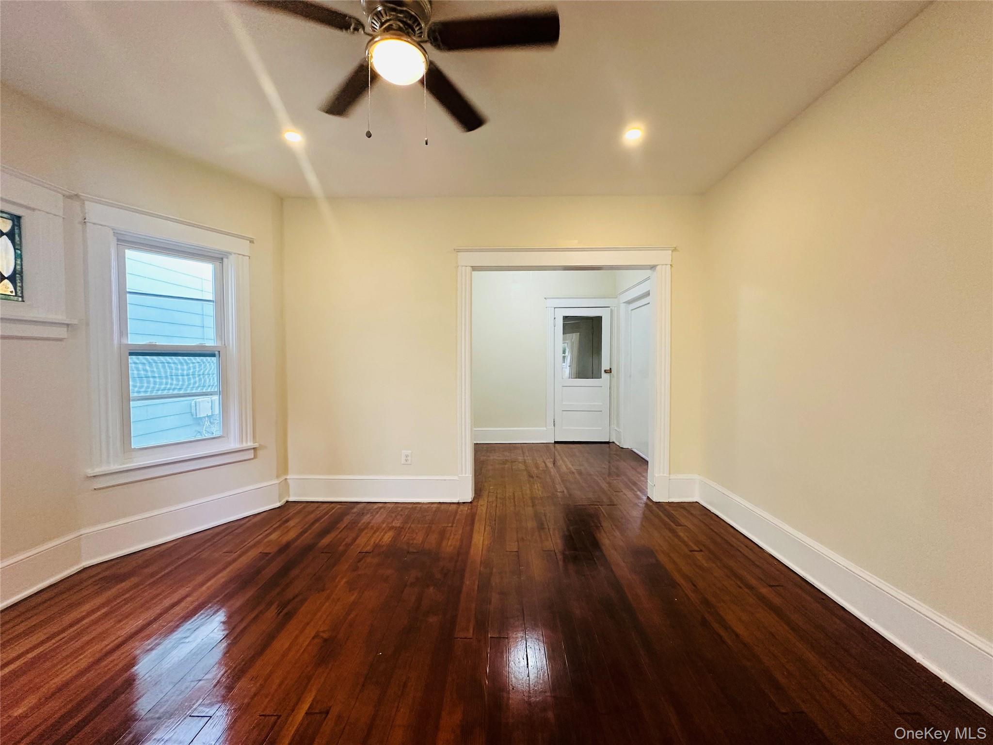 71 North Hamilton Street Poughkeepsie, NY 12601 - Photo 6 of 15 a view of empty room with wooden floor and fan