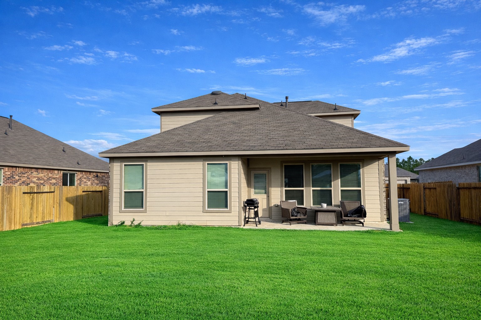 26016 Babe Ruth Drive Splendora, TX 77372 - Photo 3 of 11 a front view of house with yard and outdoor seating