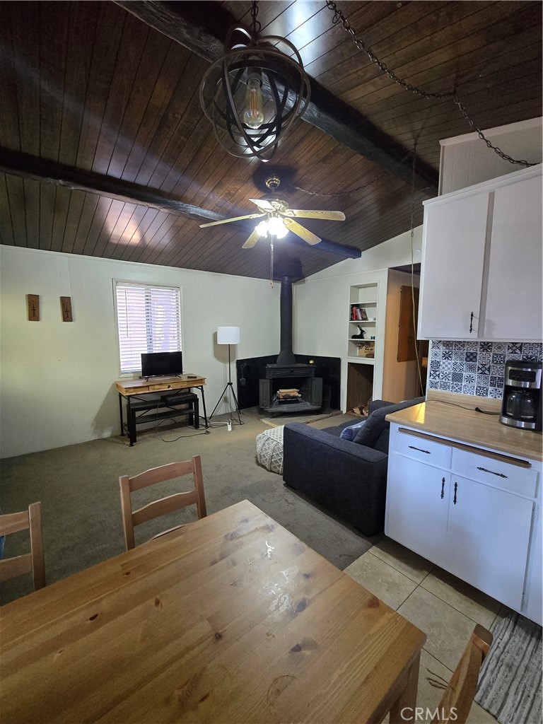 312 Riverside Avenue Big Bear City, CA 92386 - Photo 11 of 22 a large kitchen with stainless steel appliances wooden floors a stove and a refrigerator