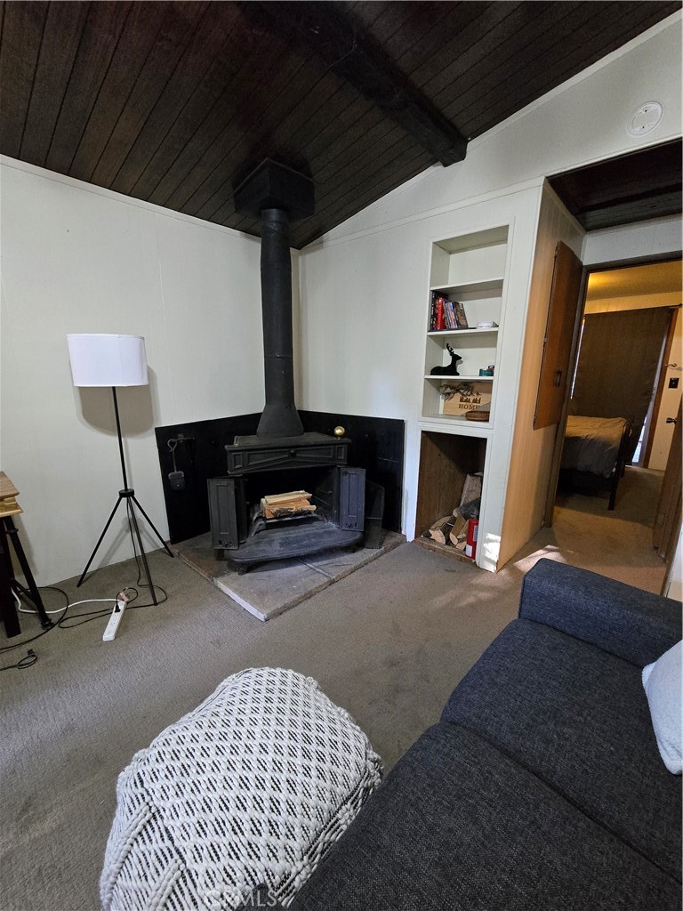 312 Riverside Avenue Big Bear City, CA 92386 - Photo 12 of 22 a living room with a couch and a coffee table