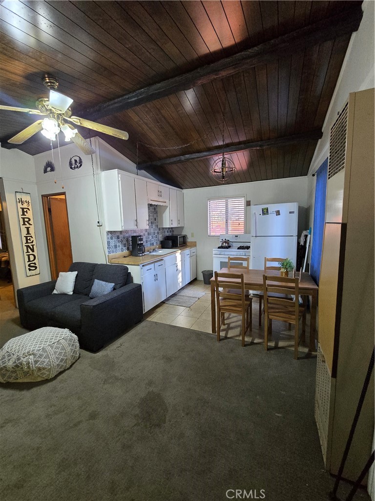 312 Riverside Avenue Big Bear City, CA 92386 - Photo 13 of 22 a living room with lots of furniture and kitchen view
