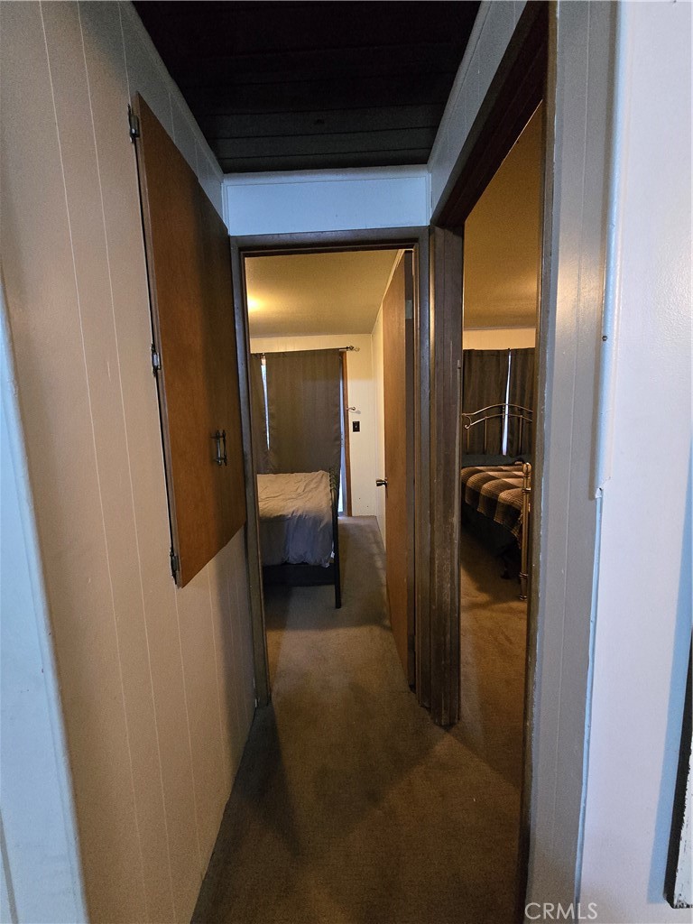 312 Riverside Avenue Big Bear City, CA 92386 - Photo 15 of 22 a view of a hallway and a livingroom and a bathroom