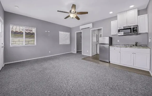 a view of a kitchen with electric appliances