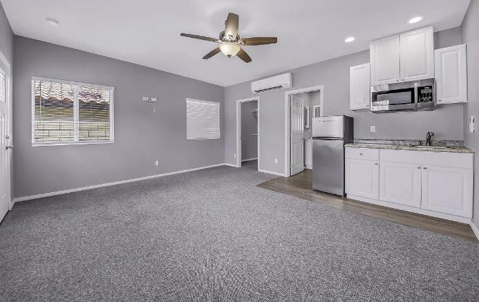 53860 Avenida Herrera, Unit A La Quinta, CA 92253 - Photo 4 of 9 a view of a kitchen with electric appliances