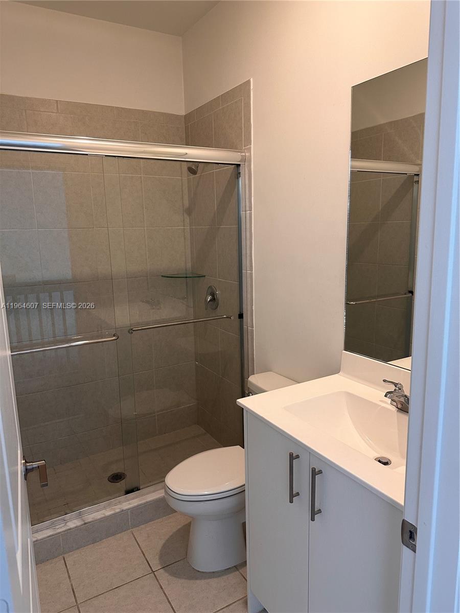 623 Southeast 13th St Circle Homestead, FL 33034 - Photo 12 of 28 a bathroom with a sink a toilet and shower