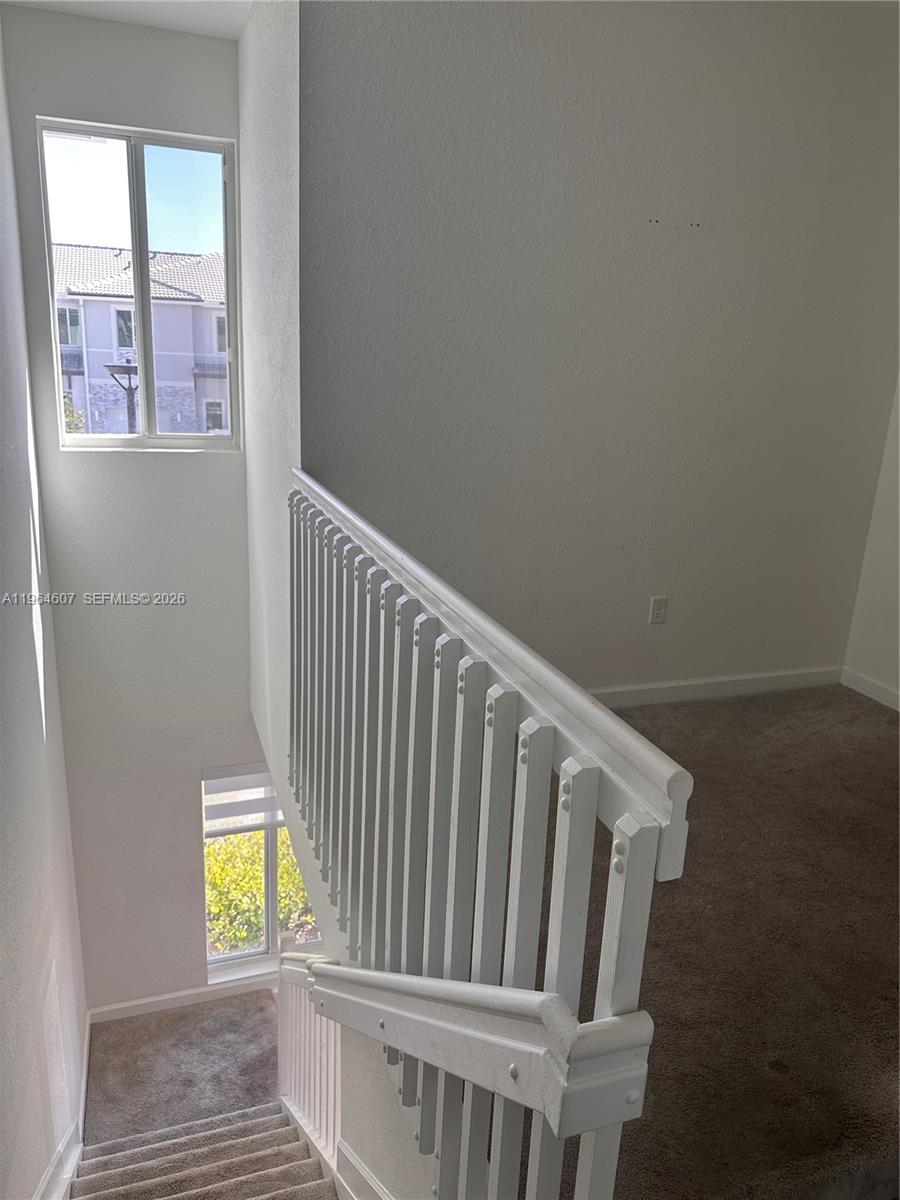 623 Southeast 13th St Circle Homestead, FL 33034 - Photo 14 of 28 a view of entryway with wooden floor and chair