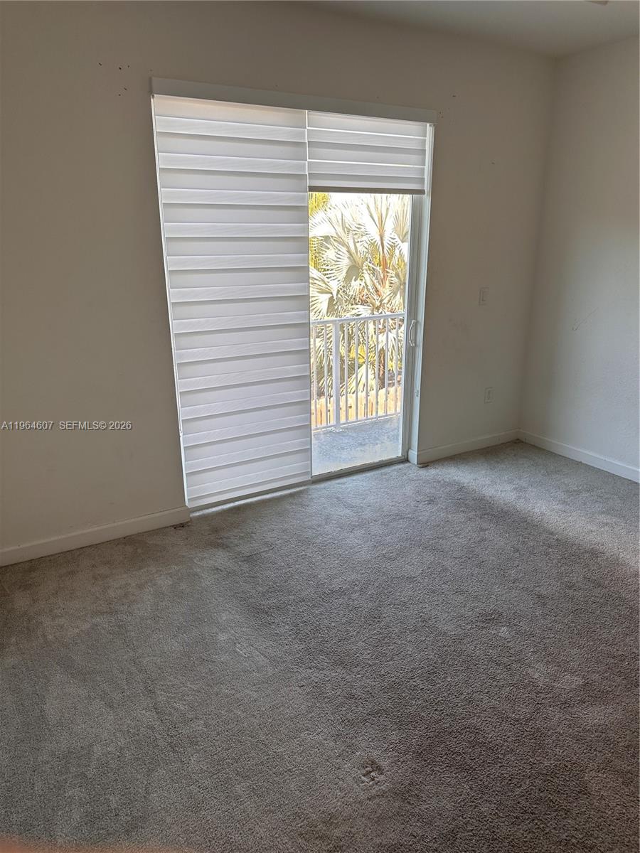 623 Southeast 13th St Circle Homestead, FL 33034 - Photo 15 of 28 a view of an empty room with a window