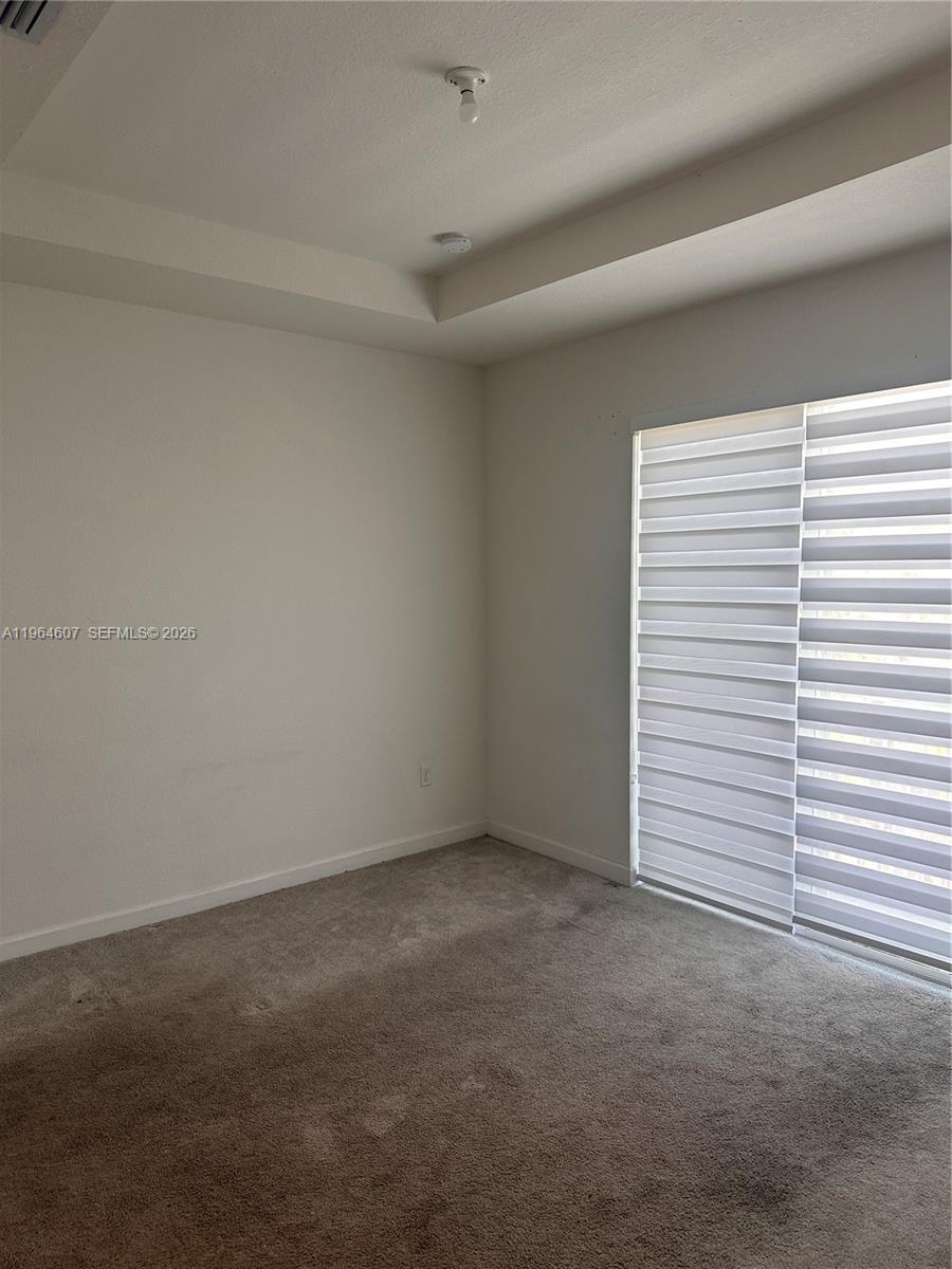 623 Southeast 13th St Circle Homestead, FL 33034 - Photo 17 of 28 an empty room with a window